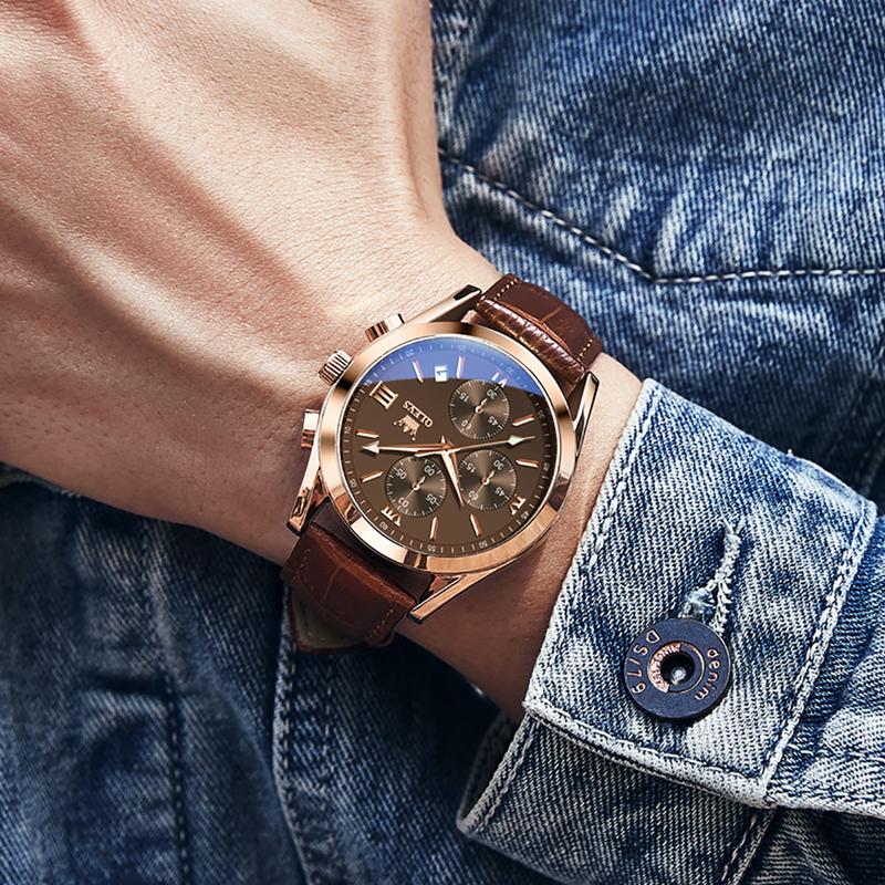 Reloj OLEVS en la muñeca con chaqueta de mezclilla