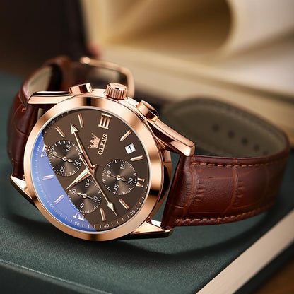 Reloj OLEVS sobre libro